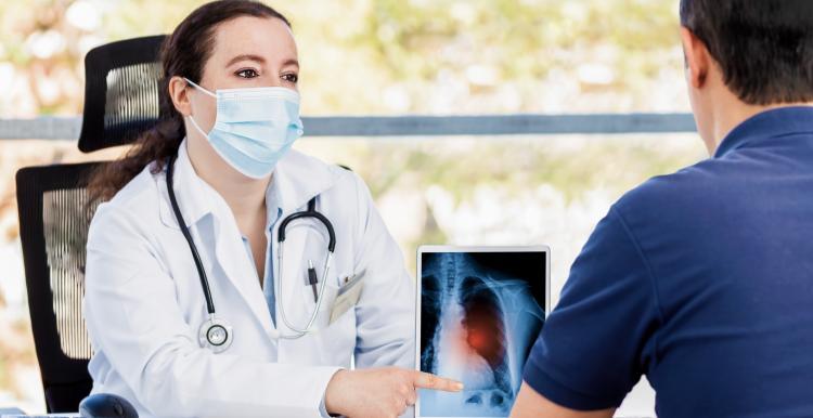 Image of a doctor speaking with a patient