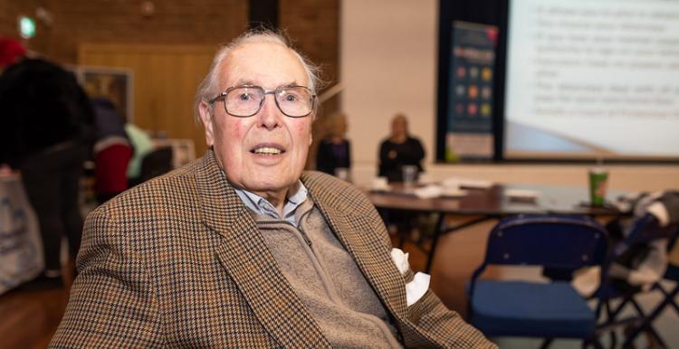 Image of older man sitting down