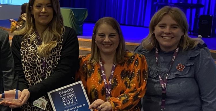 Image of people from Stockton Reslience & Reovery Project holding an award