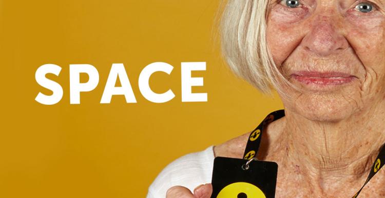 Image of woman holding lanyard for ‘Please give me space' campaign