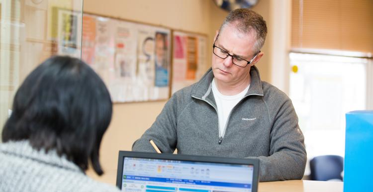 Image of man at GP reception