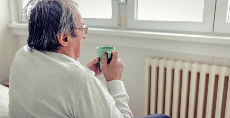 Image of a man holding a mug