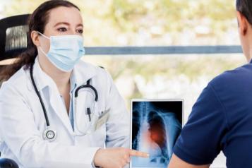 Image of a doctor speaking with a patient