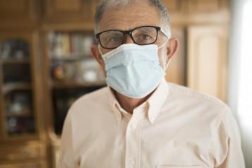 Image of man in a care home wearing a mask