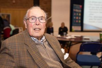 Image of older man sitting down