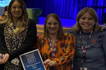 Image of people from Stockton Reslience & Reovery Project holding an award