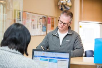 Image of man at GP reception