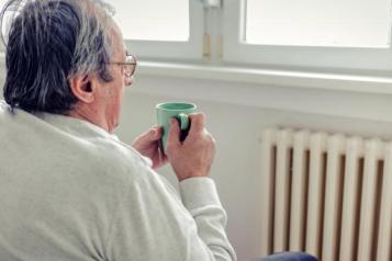 Image of a man holding a mug