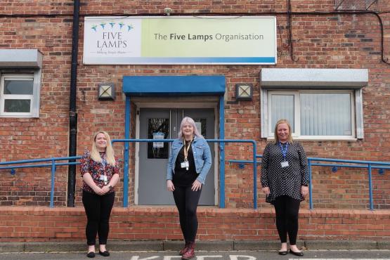 Image of three women stood outside Five Lamps community organisation in Thornaby