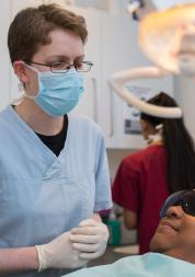 Image of dentist treating a member of the public